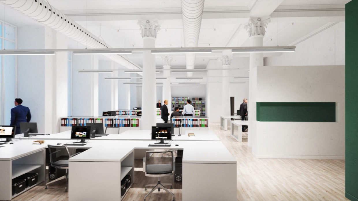 People in an open, clean office with modern luminaires.