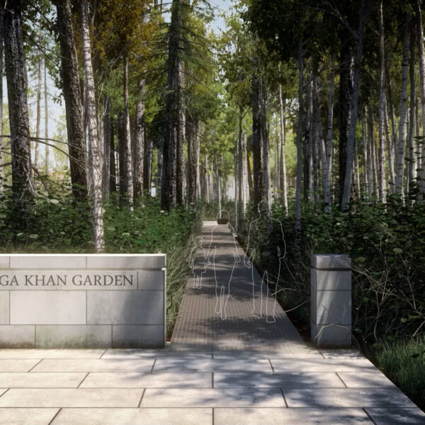 Entrance to a garden with high trees spending shadow on a sunny day. Outlines of people walking on a path.
