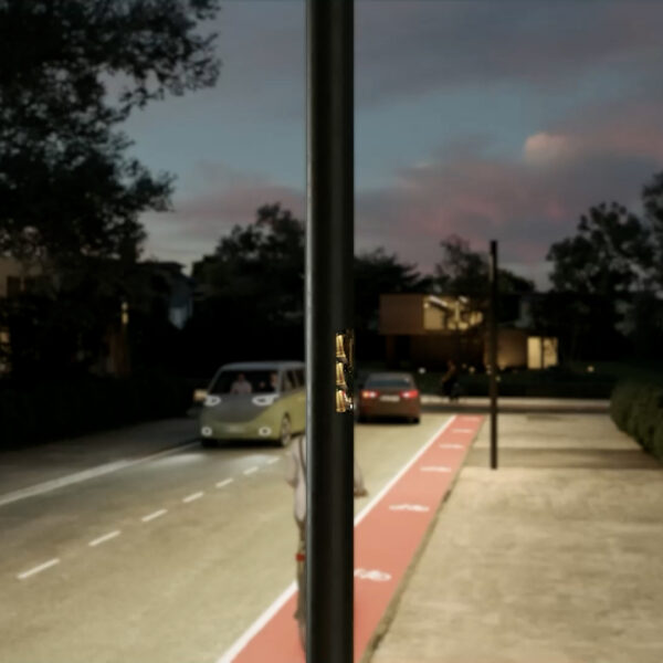 Street at nighttime with cars and red cycle track. Illuminated by innovative street lamps.