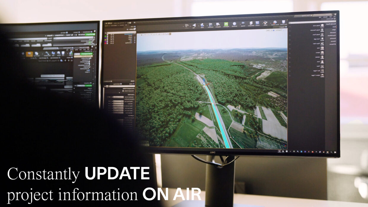 Person is looking at two monitors with an interactive application running.